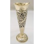 A hallmarked silver vase, tapering cylindrical part spirally fluted, pierced and chased with flowers