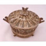 A Persian white metal two handled sugar bowl and cover to include the glass liner, approx weight