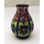 Moorcroft squat baluster vase designed by Sally Tuffin stylised violets, marks to the base, 13cm (