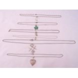 Six silver pendant necklaces, one with heart, one with pear drop crystal, one with noughts and