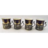 Four Coalport coffee cans with hallmarked silver pierced holders, Chester 1911