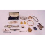 A quantity of silver and costume jewellery to include brooches, rings and wristwatches