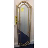 A wooden framed oval wall mirror, 170 x 50cm