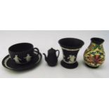 A quantity of porcelain to include Wedgwood Black Basalt Jasperware and a Moorcroft vase