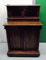 A Victorian rectangular mahogany chiffonier with two glazed cupboards above three drawers all on a