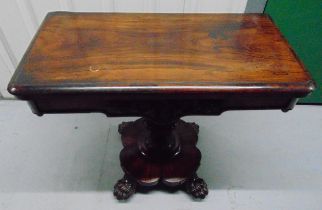 A Victorian mahogany rectangular games table, the pedestal base on four claw feet, 75 x 91.5 x
