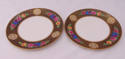 A pair of Spode Regency cabinet plates decorated with flowers in a gilded trellis border, marks to