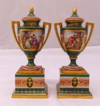 A pair of Vienna vases and covers with side panels decorated with classical scenes on raised