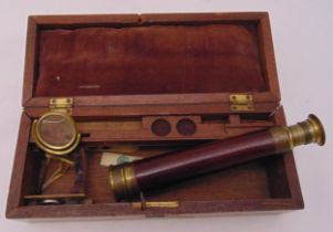 A late 19th century brass telescope in fitted case to include accessories