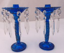 A pair of blue glass lustres with crystal drops on raised circular spreading bases, 26cm (h)