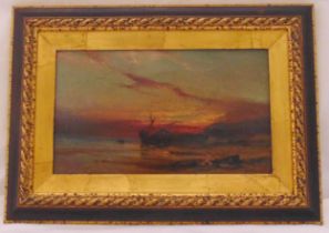 A framed 19th century oil on canvas of a shipwreck at sea, 18.5 x 31.5cm