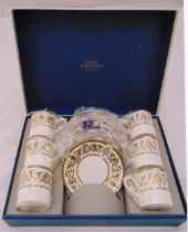 A cased Royal Worcester coffee set to include six cups and saucers, dated 1969