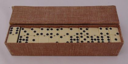 A cased set of mid 20th century dominoes of customary form