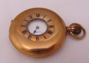A Waltham gold plated half hunter pocket watch with white enamel dial, Roman numerals and subsidiary