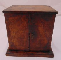 A burr walnut chest of rectangular form with hinged doors on raised rectangular base, A/F, 31 x 31 x