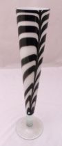 A mid 20th century art glass vase decorated with zebra stripes on raised circular spreading base,