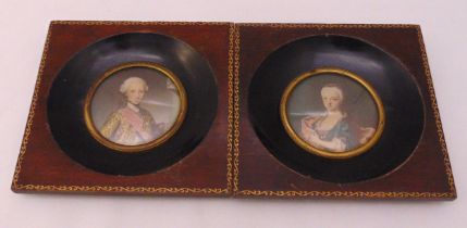 A pair of polychromatic hand painted miniatures of a gentleman and lady in 18th century costume