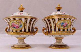 A pair of Royal Crown Derby vases and covers, of waisted cylindrical form decorated with floral