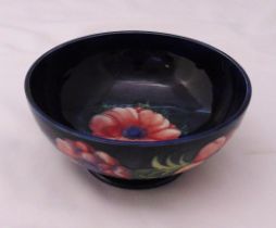 William Moorcroft blue ground fruit bowl decorated with flowers, marks to the base, 19cm (dia)