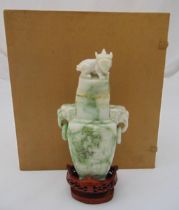 A Chinese mid 20th century carved jadeite vase and cover with ring handles, the pull off cover