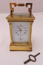 Rapport of France brass repeating carriage clock of customary form with white enamel dial Roman