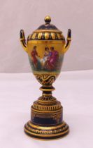 A Vienna vase and cover, ovoid form with pierced side handles decorated with classical scenes on