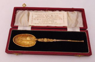 A silver gilt anointing spoon in fitted case