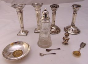 A quantity of hallmarked silver to include a pair of trumpet vases with pierced tops, a pair of