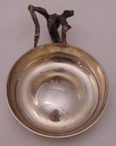 A hallmarked silver tasse de vin circular with antler branch handle by Anthony Gordon Elson London