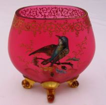 A continental cranberry glass vase with applied bird and branch to the side on four scroll legs,