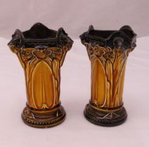 A pair of Royal Doulton shaped triangular vases with stylised leaf sides on raised circular bases