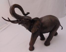 A 20th century cast bronze bellowing African elephant, 42 x 63 cm