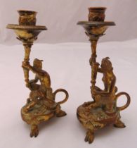 A pair of figural brass candlesticks on hoof feet with pierced handles, 17.5cm (h)