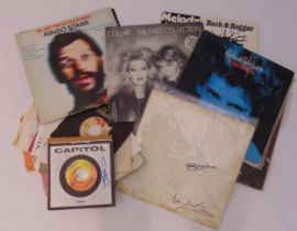 A quantity of vinyl albums and singles to include two Beatles records bearing signatures