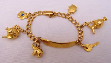 18ct yellow gold identity bracelet with six charms, approx total weight 28.6g
