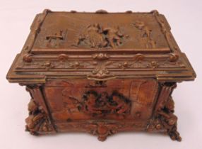 A continental copper jewellery casket of rectangular form with figures carved in relief to the sides