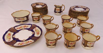 A late 19th century Staffordshire teaset to include cups, saucers, plates, cake plates, a bowl and a