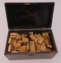 An oriental bamboo Mah-jong set in a rectangular hardwood casket