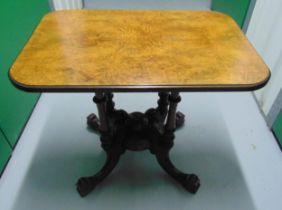 A late 19th century mahogany and walnut rectangular occasional table on four carved outswept legs,