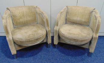 A pair of French Art Deco tub chairs with original upholstery on four cylindrical legs