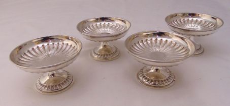 Four Mappin and Webb hallmarked silver bonbon dishes, circular part fluted on raised circular bases,