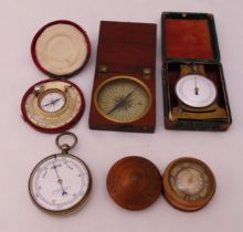 A quantity of scientific collectables to include barometers, compasses and a gauge (5)