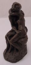 A resin figure of Rodin The Kiss on naturalistic base, 25cm (h)