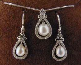 9ct white gold pearl and diamond pendant on a 9ct gold chain and a matching pair of earrings
