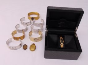 A quantity of hallmarked silver bangles, two gold plated lockets and a Fuel Swiss quartz diamond