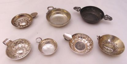 Seven French white metal, silver plate and pewter tasse de vins of varying design and form