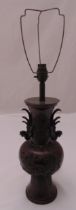 A Chinese early 20th century bronze lamp base decorated with cockerels flowers and leaves, 57cm (h)