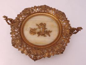 A gilt metal and marble table centrepiece of circular form with scroll pierced border, two scroll