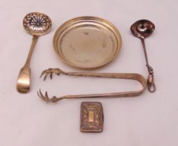 A quantity of hallmarked silver and white metal to include a coaster, a pair of ice tongs, a sugar