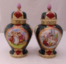 A pair of Vienna vases and covers decorated with classical scenes to the sides, marks to the